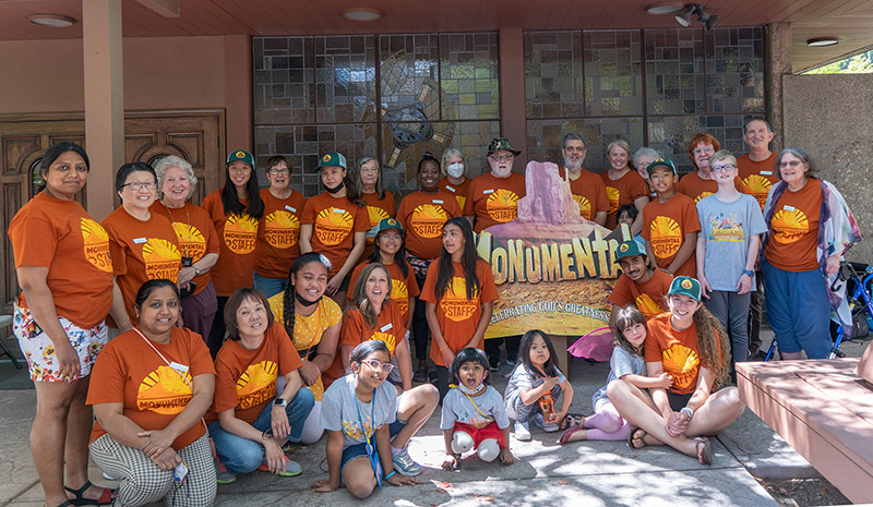 large group photo of vacation bible school volunteers and children