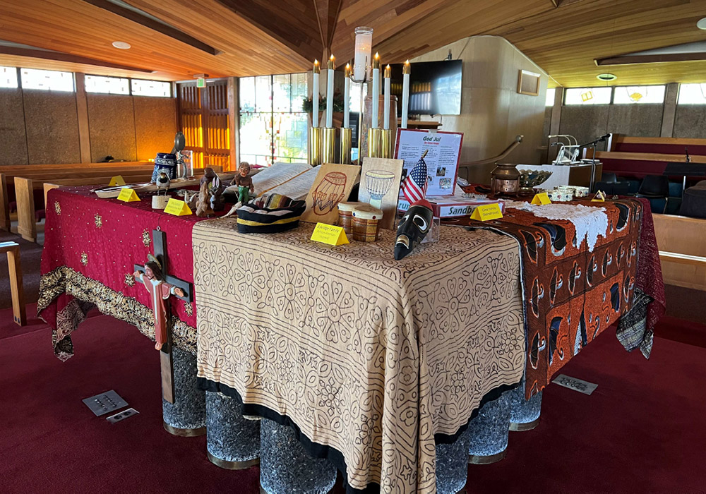 church altar decorated with artifacts from many different cultures and backgrounds